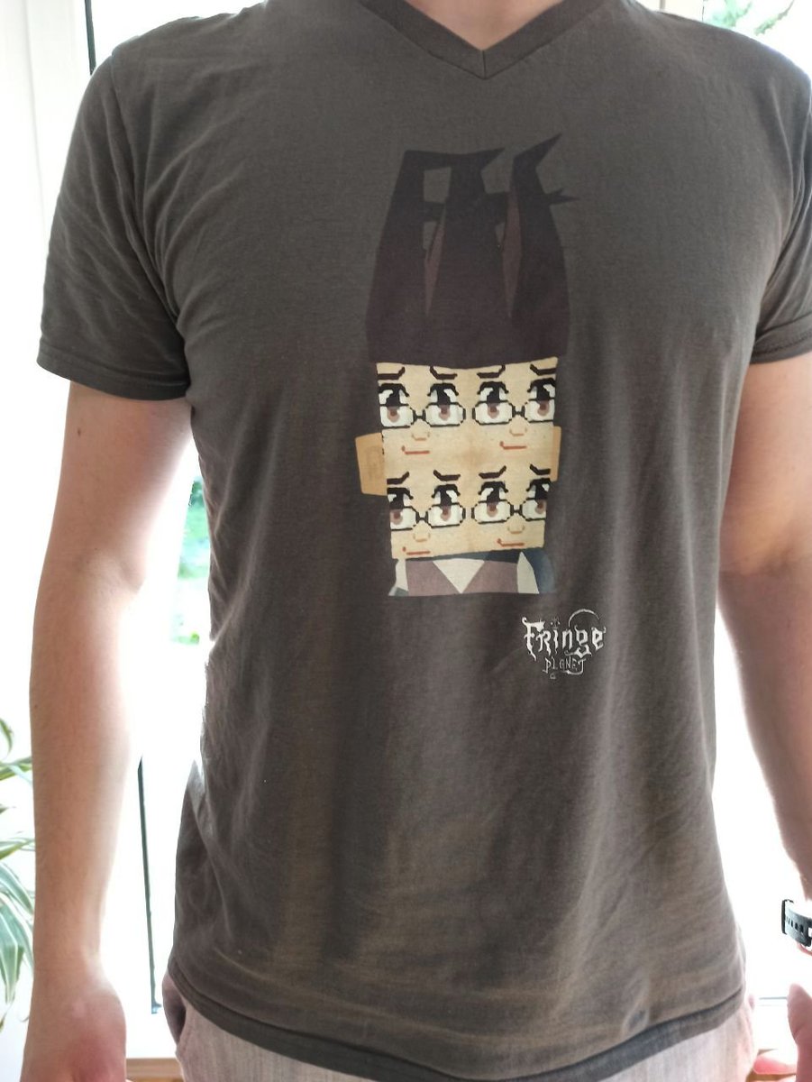 A t-shirt showing fourface and the Fringe Planet logo 